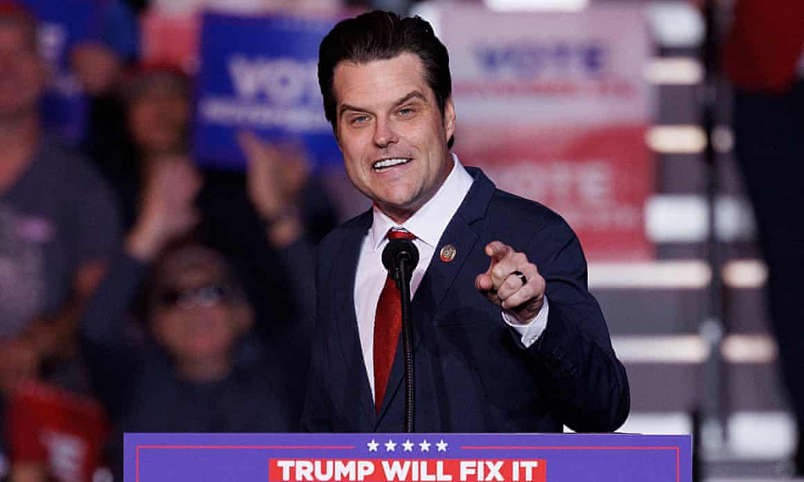 Matt Gaetz at podium that says 'Trump will fix it'