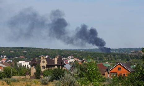 Smoke rises after shelling in the city of Donetsk.