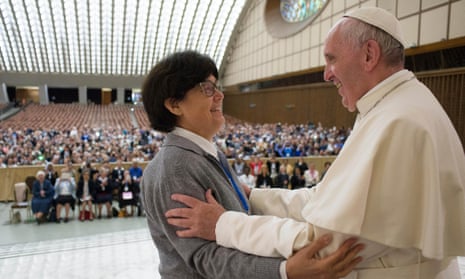 Pope Francis greets a missionary sister at a conference in the Vatican on Thursday