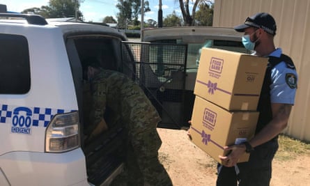 Wilcannia police and soldiers prepare a food run for people in Wilcannia.