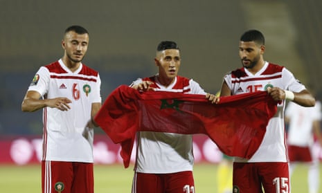 The Moroccan players celebrate after the match.