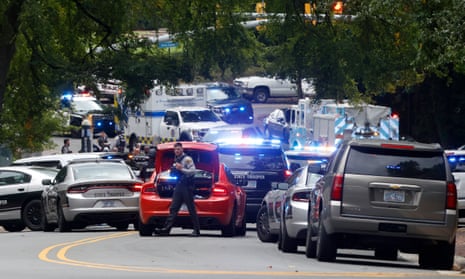 Law enforcement and first responders gather on South Street near the Bell Tower on the University of North Carolina campus on 28 August.
