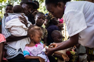 Children are screened for malnutrition at Saint Martyr health clinic in the Congolese city of Kananga