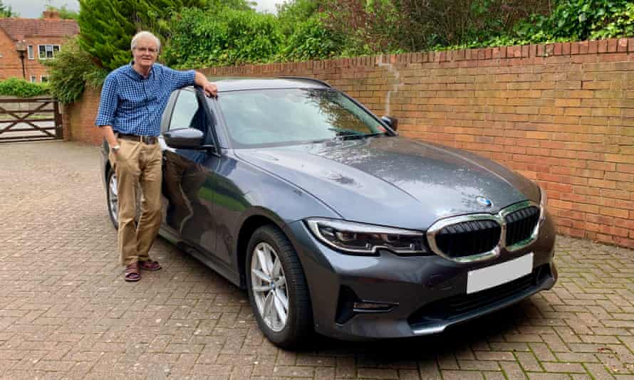 The Rev Robert Paterson with his BMW 330e which made his car tax go from zero to GBP480.