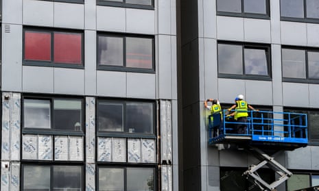 Cladding being removed from Whitebeam Court, in Pendleton, Greater Manchester. 