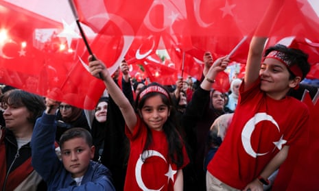 Supporters of the outgoing president Recep Tayyip Erdogan his AKP party cheer as early results come through