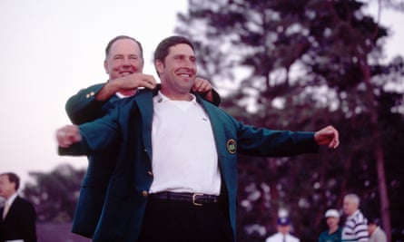 Mark O'Meara (left) gives the green jacket to José María Olazábal after the Spanish golfer's victory at the 1999 Masters.