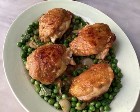 Rachel Roddy’s spring chicken thighs with spring onions, mint and peas.