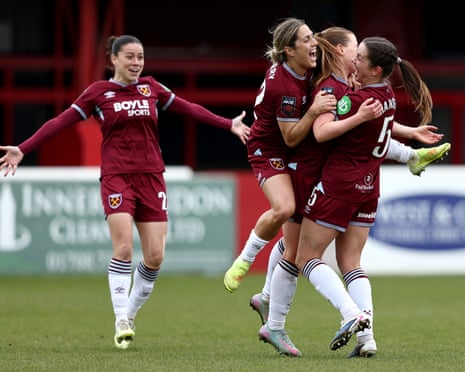 Siren is congratulated by her teammates after scoring.