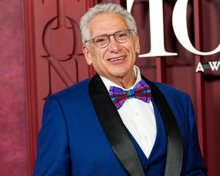 Harvey Fierstein successful a tuxedo pinch colourful chequered necktie successful beforehand of a burgundy backdrop astatine nan 78th yearly Tony awards reddish carpet, Radio City Music Hall, June 2025 successful New York City