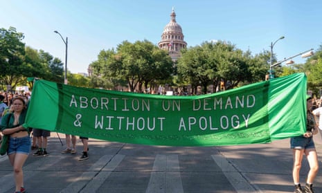 Abortion rights demonstrators march near the state capitol building in Austin, Texas, on 25 June.