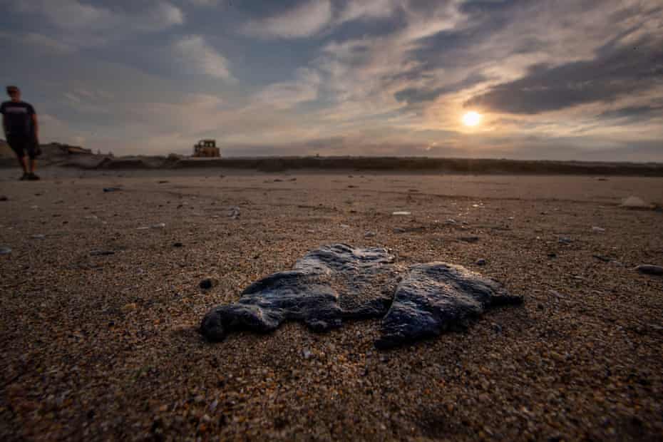 A large globule of oil in the sand from a major oil spill on Huntington state beach.