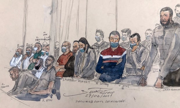 Court-sketch made on 27 June 2022, shows defendant Salah Abdeslam (R) standing next to 13 other defendants.