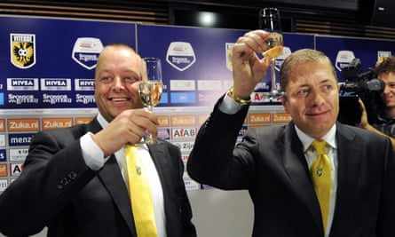Merab Jordania (right) announced he had bought Vitesse Arnhem in August 2010 at a press conference where he celebrated with the president of the club’s board, Maasbert Schouten (left).
