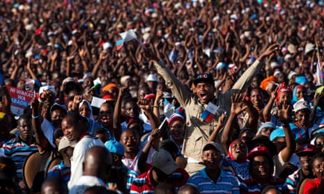 People hold up their hands during a political rally for Ukawa, a coalition of four main opposition parties, in Dar es Salaam, Tanzania, on August 29, 2015