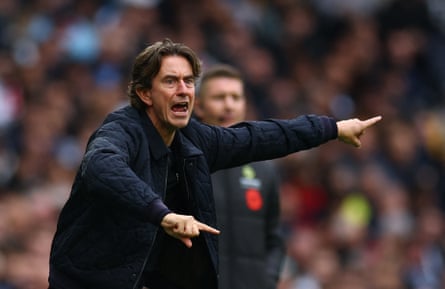 Spurs head Thomas Frank directs his players against Manchester United.