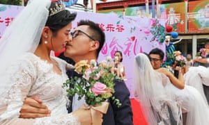 a group wedding held at the Happy Valley amusement park in Shanghai, China