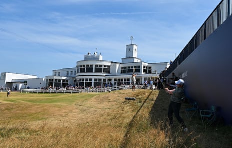 Robert Macintyre plays to the 18th Green in front of the clubhouse.