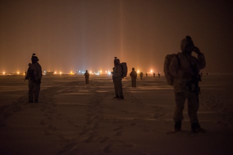 US marines and Army special forces walking toward a long range radar station operated by NORAD in Utqiaġvik, formerly known a Barrow, in Alaska, the most northerly point of the US. These troops are taking part in the US military’s annual Arctic Edge exercise, which takes place across Alaska and involves numerous branches of the U.S. military.