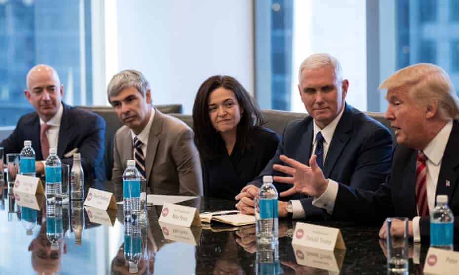 Jeff Bezos of Amazon, Larry Page of Alphabet, Sheryl Sandberg of Facebook, and then vice-president elect Mike Pence listen to Donald Trump in December.