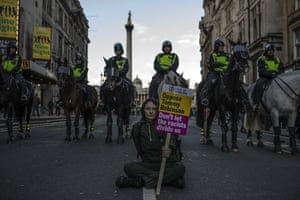 A counter-demonstrator in front of a line of police horses at a ‘Brexit betrayal’ rally in central London.