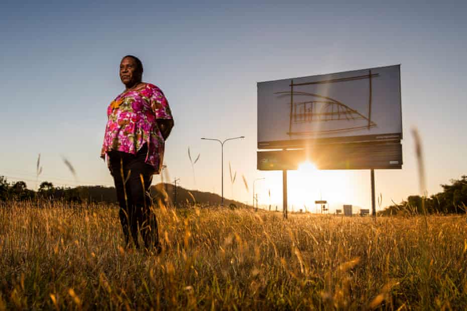 Gail Mabo in front of her Mabo Claim I billboard on the Bruce Highway in Deeragun