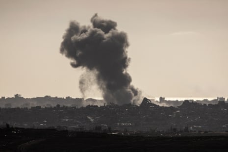 Smoke rises above destroyed buildings after Israeli strikes in the northern Gaza Strip on Monday.