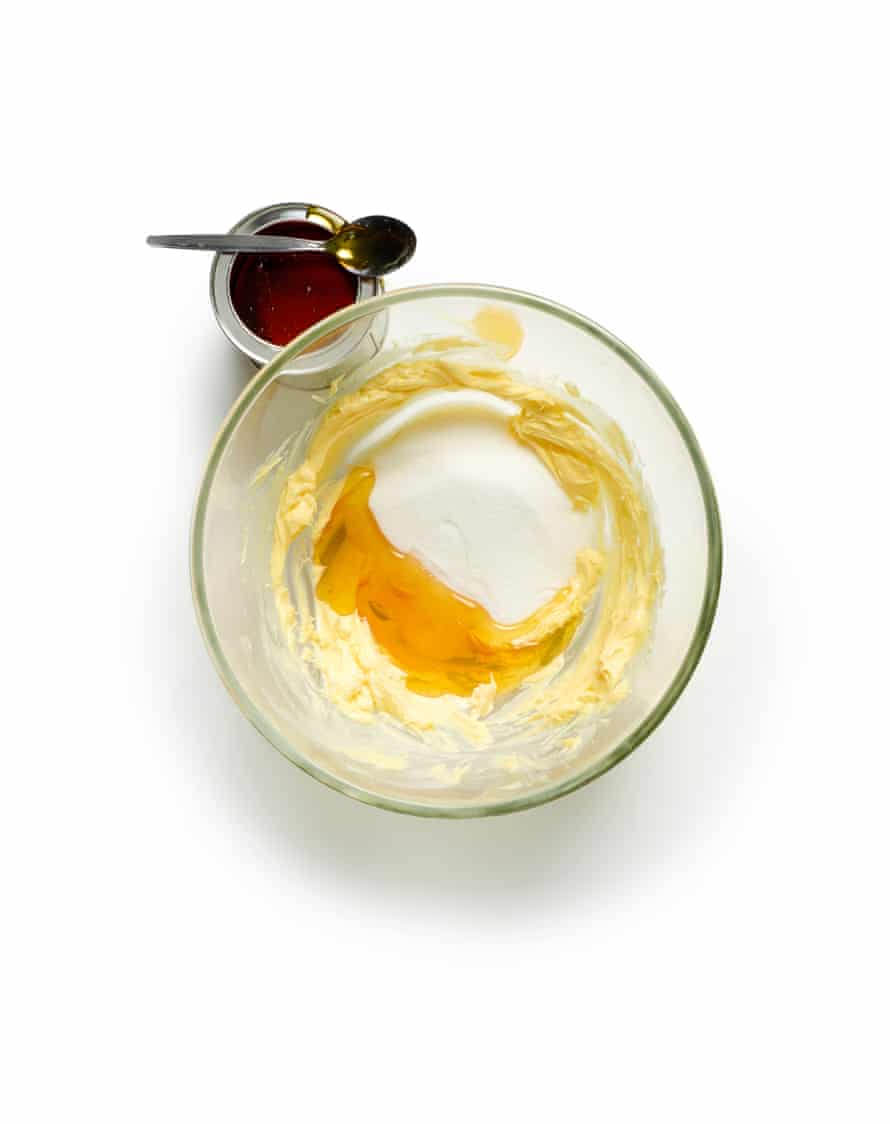 Glass bowl with beaten butter sugar and syrup inside