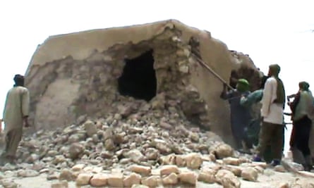 A screengrab from footage showing militants destroying one of the mausoleums in Timbuktu in 2012