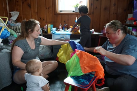 two women playing with a child