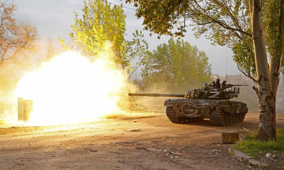 Pro-Russian forces fire from a tank during fighting near the Azovstal steel plant in Mariupol, southern Ukraine