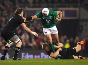 Rory Best powers through two All Black tacklers during Ireland’s 2018 victory in Dublin.