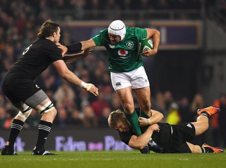 Rory Best powers through two All Black tacklers during Ireland’s 2018 victory in Dublin.