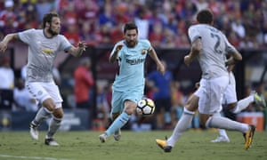 Lionel Messi tries to get past Daley Blind and Victor Lindelof
