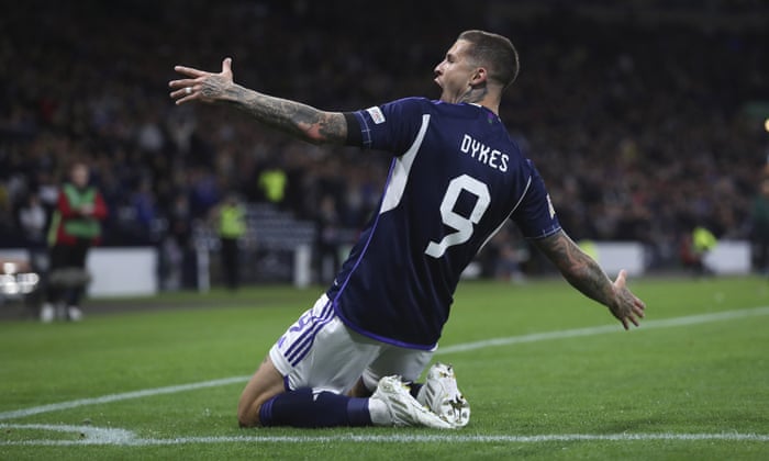 Lyndon Dykes celebrates scoring his second, and Scotland’s third, goal