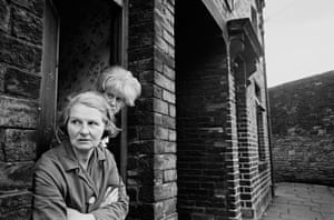 Bradford, 1969. A mother and daughter outside their slum terraced house