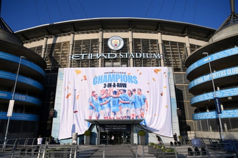 A 'Premier League Champions' banner is revealed outside the Etihad stadium after Manchester City were confirmed as 2022/23 Premier League champions after Nottingham Forest beat Arsenal.