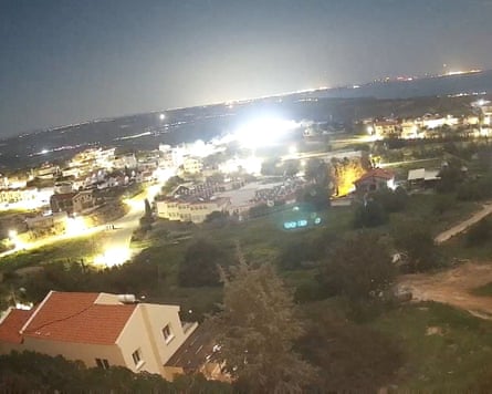 Flashes appear in the sky over RAF Akrotiri on 1 March as a drone smashes into a hangar.
