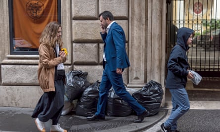 Matteo Salvini, the Italian deputy prime minister and leader of the League, walks near rubbish sacks in Via Condotti, near the Spanish steps