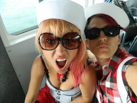 Melania Jack and Patty Preece take a selfie on a boat, on their way to a music festival. They’re dressed in novelty sailor hats.