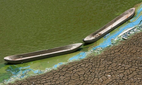 Wooden boats at the base of a dried-up reservoir, Indonesia, during record temperatures in 2015. 