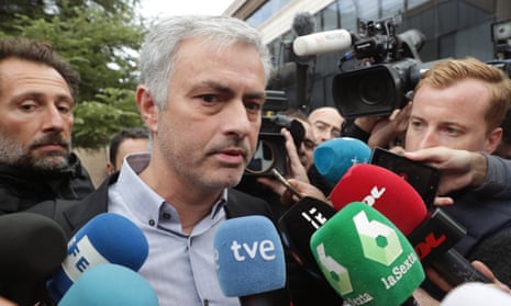 José Mourinho is confronted by journalists after leaving court in Pozuelo, to the west of Madrid, on Friday
