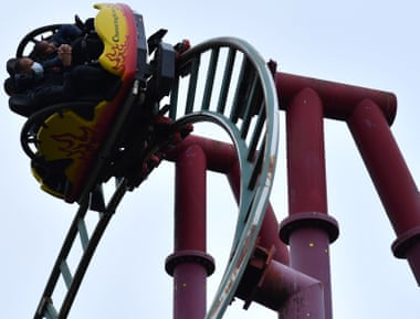 Thrill-seekers ride the Land of the Dragons ride at Chessington World of Adventures Resort in Chessington, Greater London on July 4, 2020