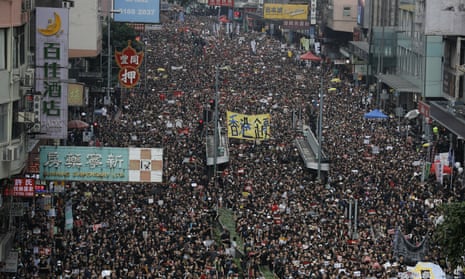 Tens of thousands of protesters march through Hong Kong in June 2019.
