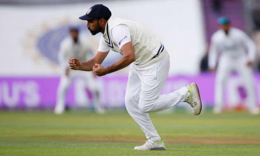 Mohammad Shami celebrates taking a catch to dismiss Devon Conway.