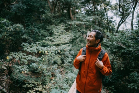 Man enjoying hike in forest in winter, Shizuoka, Japan