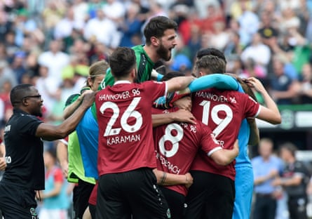 Hannover players celebrate a return to the Bundesliga.