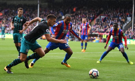 Southampton’s Dusan Tadic attempts to get the better of Palace’s Jason Puncheon.