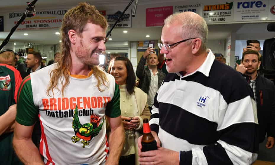 Scott Morrison meets a player, Jarrod Cirkle, at the Bridgenorth Football Club in Launceston during the 2019 Australian federal election campaign.