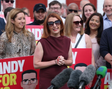 Louise Haigh in fronts of supporters with Andy Burnham campaign banners